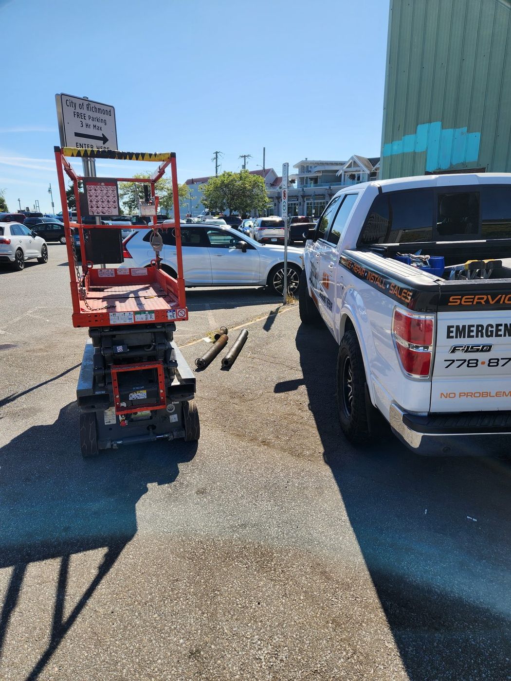 High-clearance commercial door repair from a scissor lift in Richmond BC