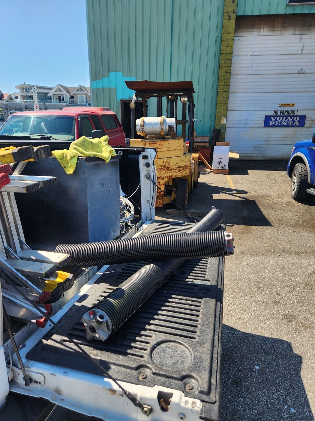 New torsion springs ready for installation at a commercial site