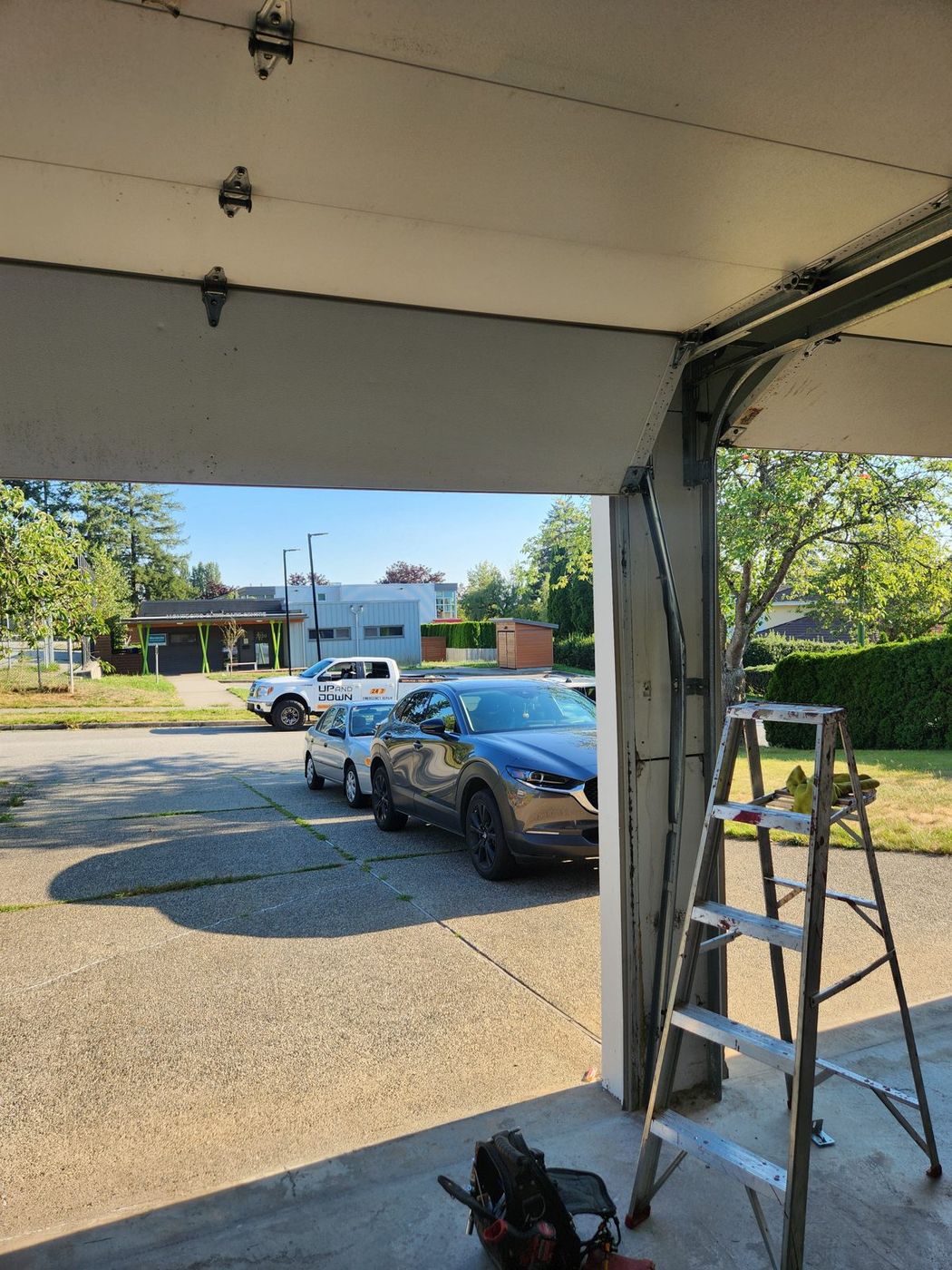Double residential garage door during a tune-up