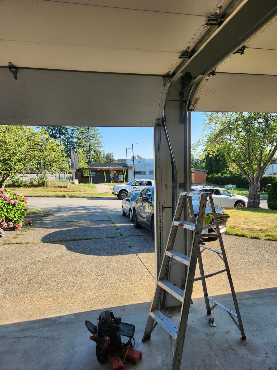 Residential garage door open during a service visit