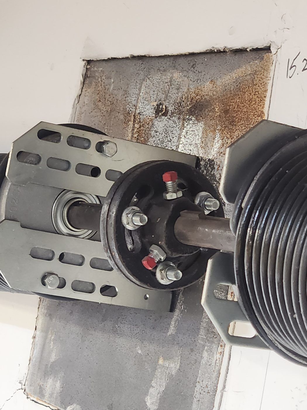 Garage door torsion spring and cable drum hardware close-up — Up and Down Garage Doors repair
