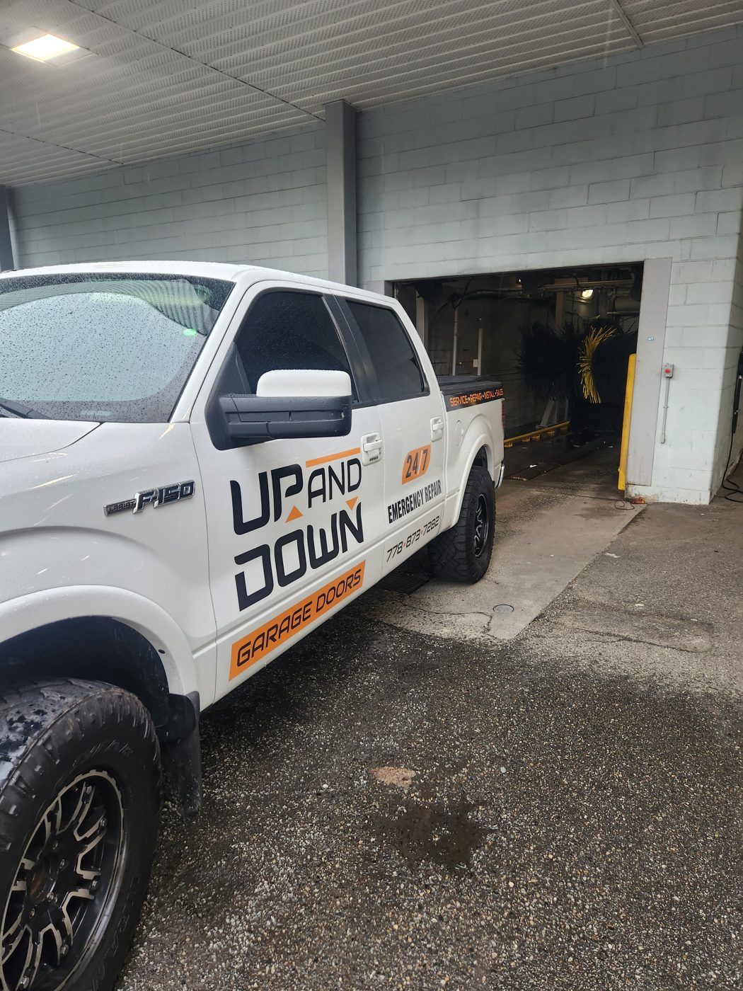 Up and Down Garage Doors service truck in an underground parkade, Metro Vancouver