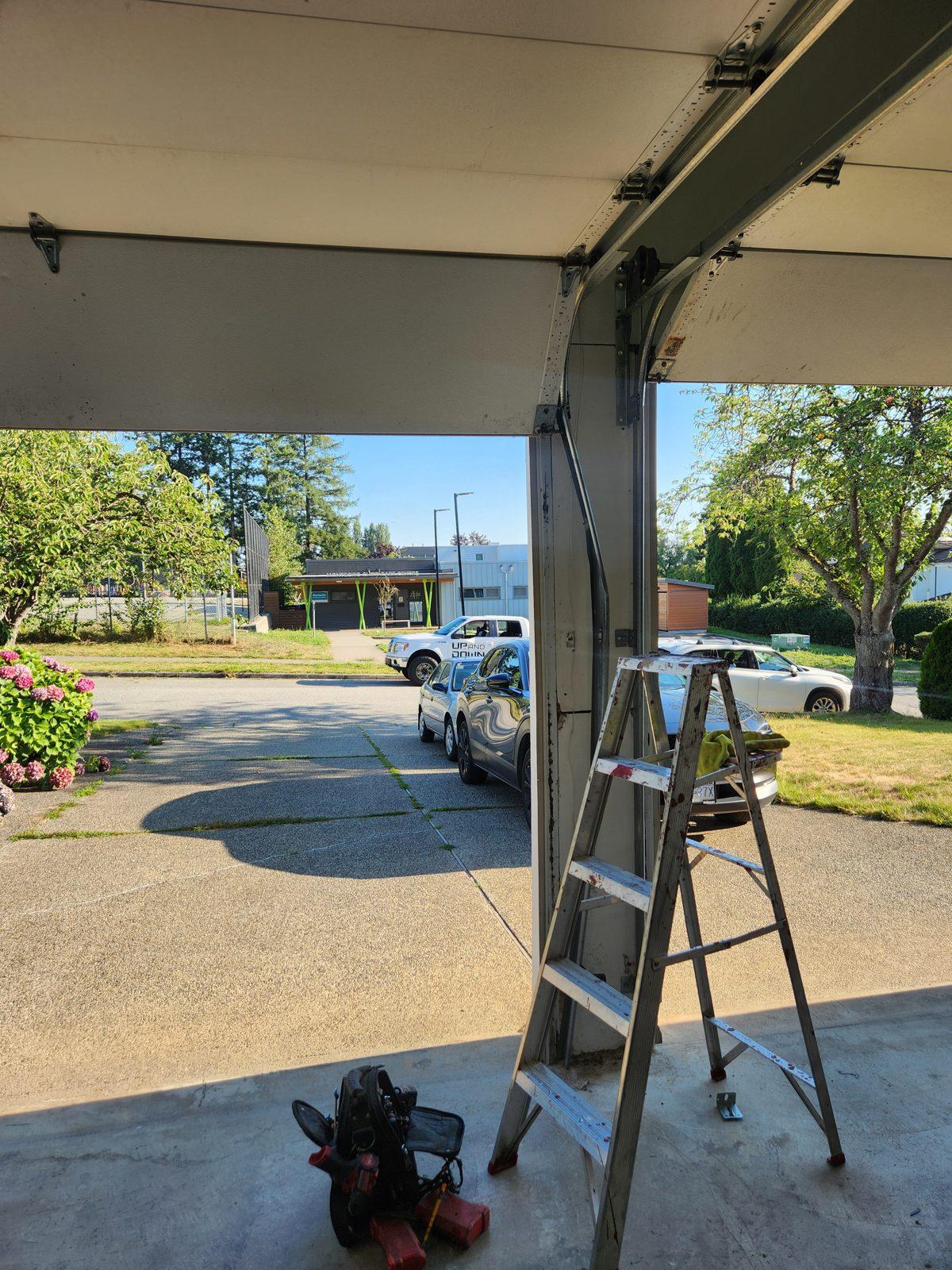 Residential garage door open during a service visit