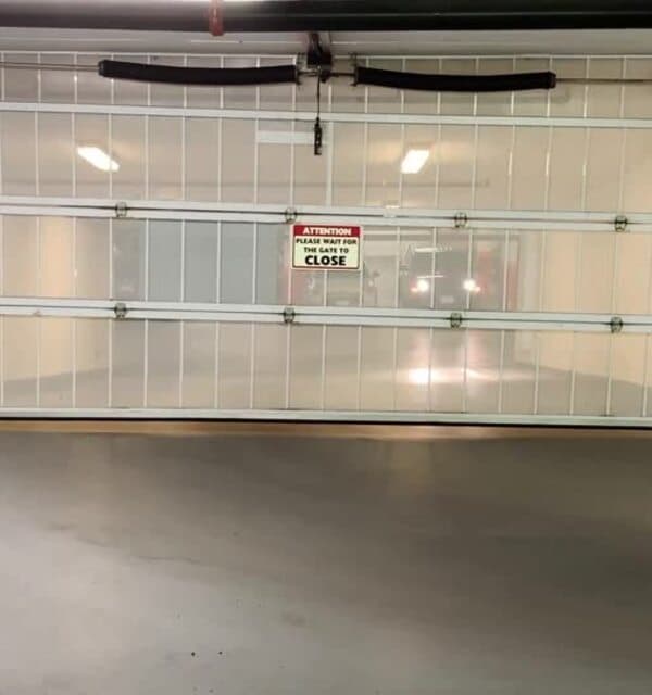 Up and Down Garage Doors technician repairing a residential garage door