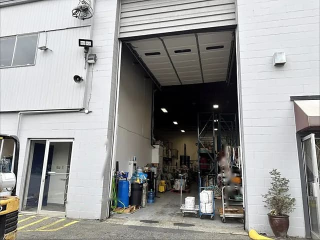 Commercial service bay door kept on a maintenance schedule