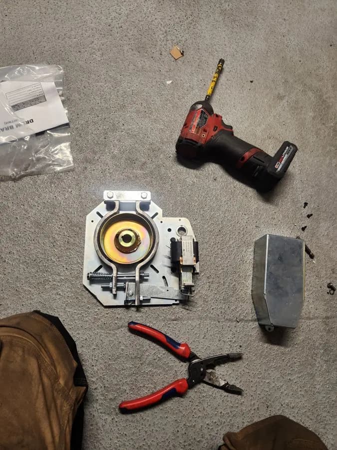 Garage door opener motor and gear parts during a rebuild