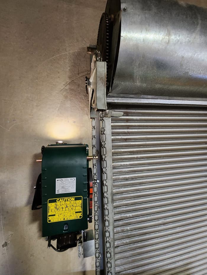 Commercial security rolling door serviced at a Metro Vancouver retail space — Up and Down Garage Doors