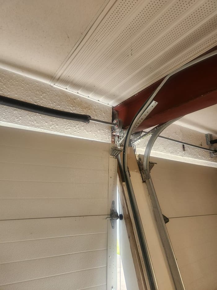 Garage door torsion spring and track repair, ceiling-mounted rollers — Up and Down Garage Doors