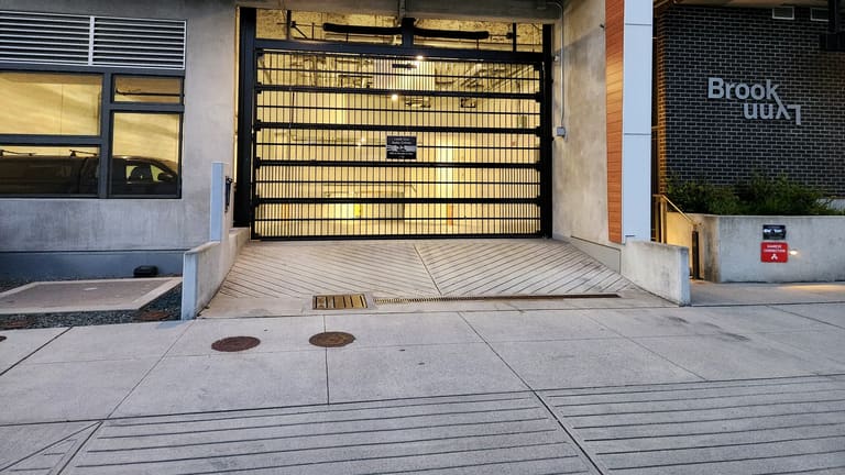 Strata parkade gate serviced by Up & Down Garage Doors in Richmond, BC