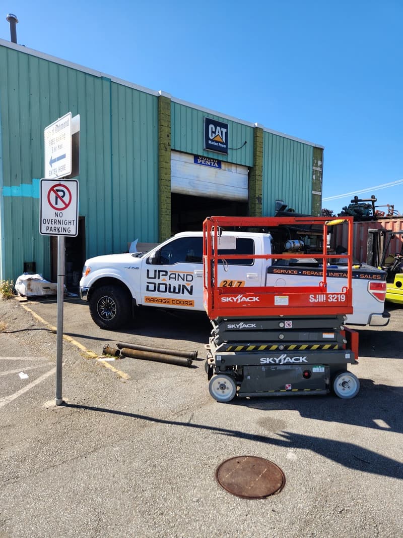 scissor lift in use on a commercial door job in Richmond