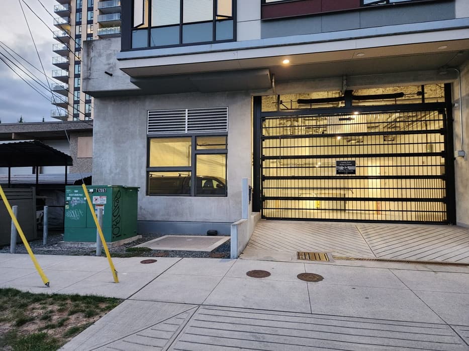 Commercial roll-up garage door installed on a Metro Vancouver condo building — Up and Down Garage Doors