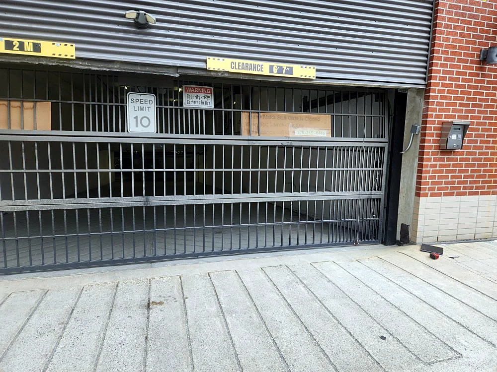 Rolling security grille — Commercial parkade entrance, Up & Down Garage Doors job