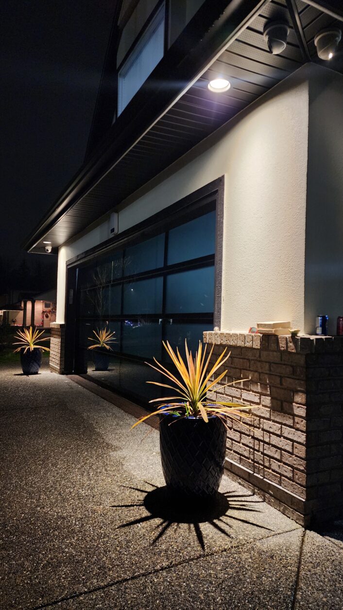 Modern glass full‑view garage door installation in Kerrisdale
